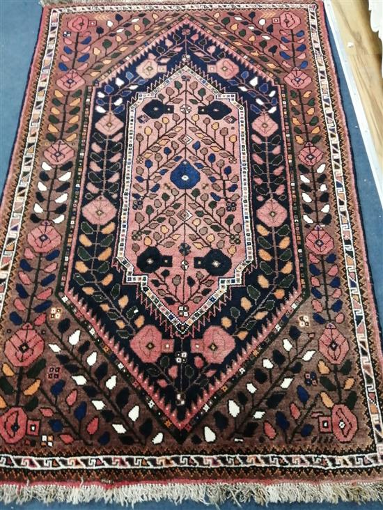 A Caucasian pink ground rug 175 x 115cm